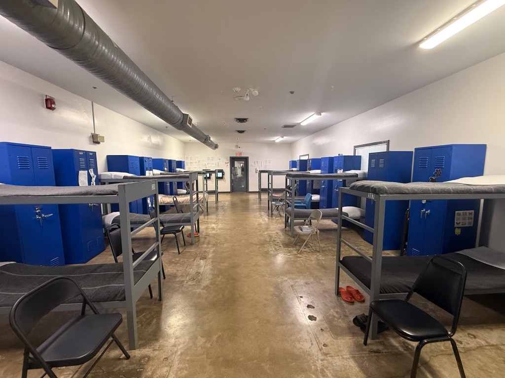 Dormitory-style recovery housing room with bunk beds and blue lockers at a Shepherd's House statewide expansion facility