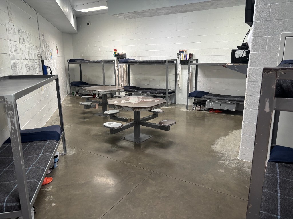 Dormitory room with bunk beds and fixed tables inside a Kentucky correctional facility SAP program
