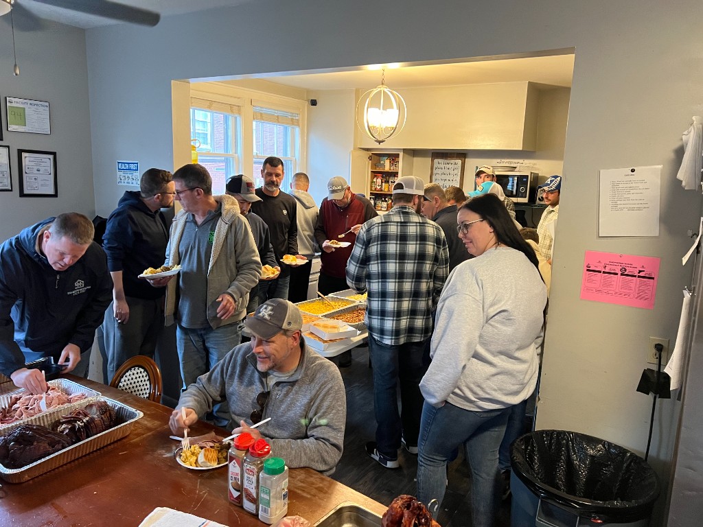 Residents of the Fontaine recovery housing program sharing a communal meal together