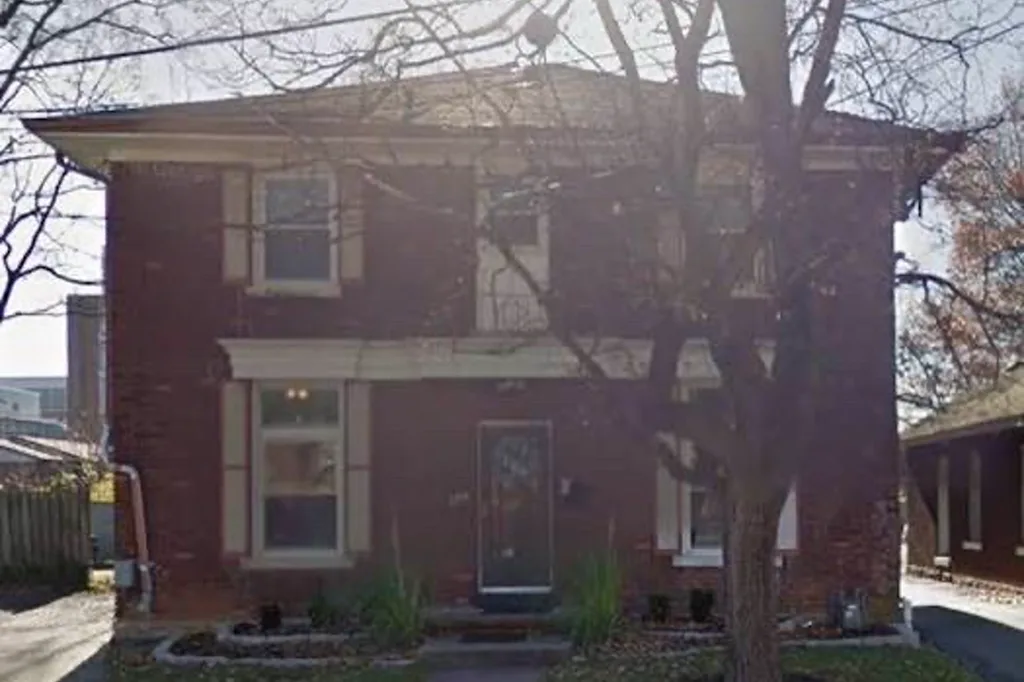 Exterior of Bonnie Brae (Maxwelton), a two-story red brick Shepherd's House recovery housing home with white trim