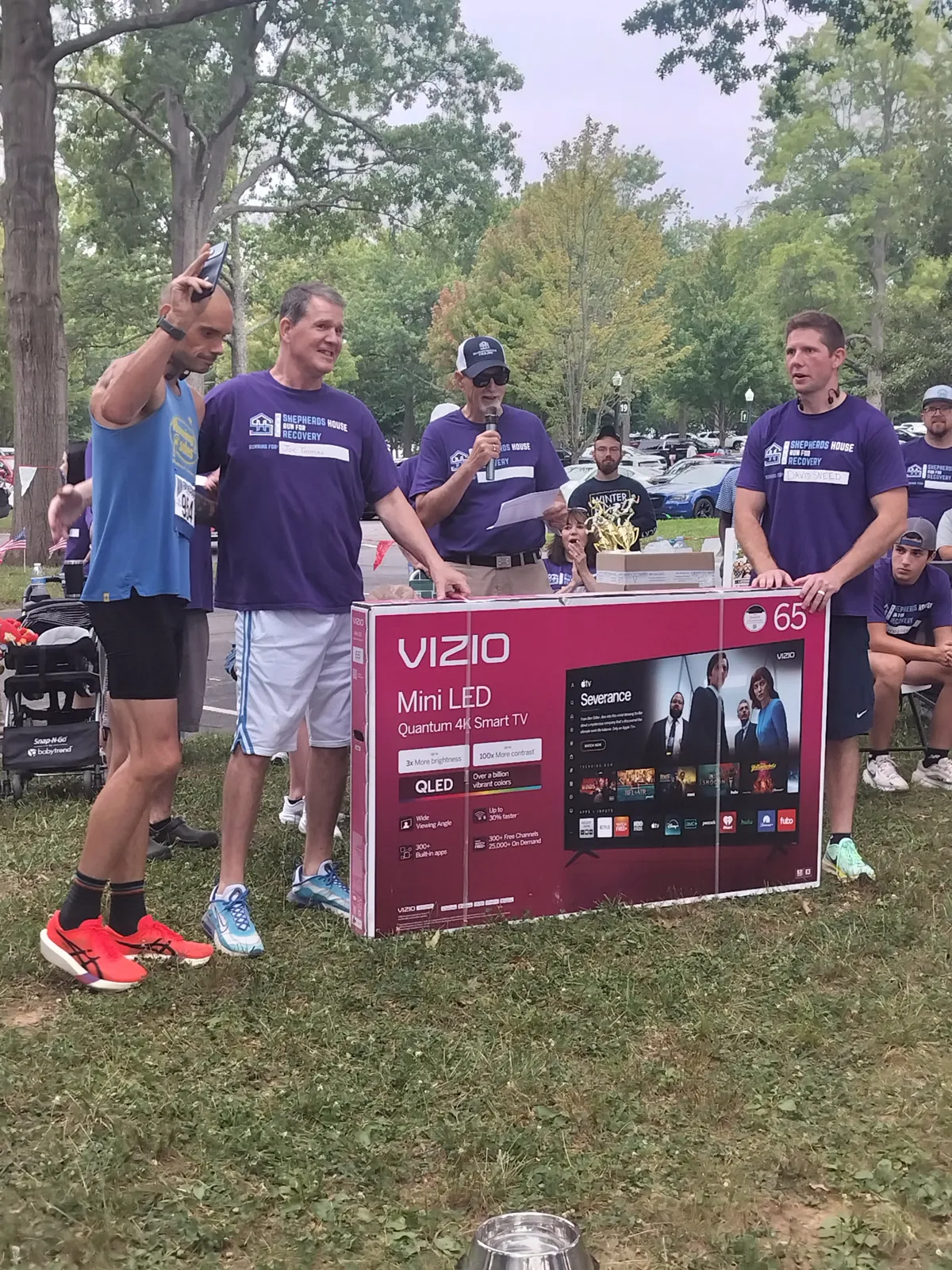 Runners and a dog enjoying the pet-friendly Run for Recovery