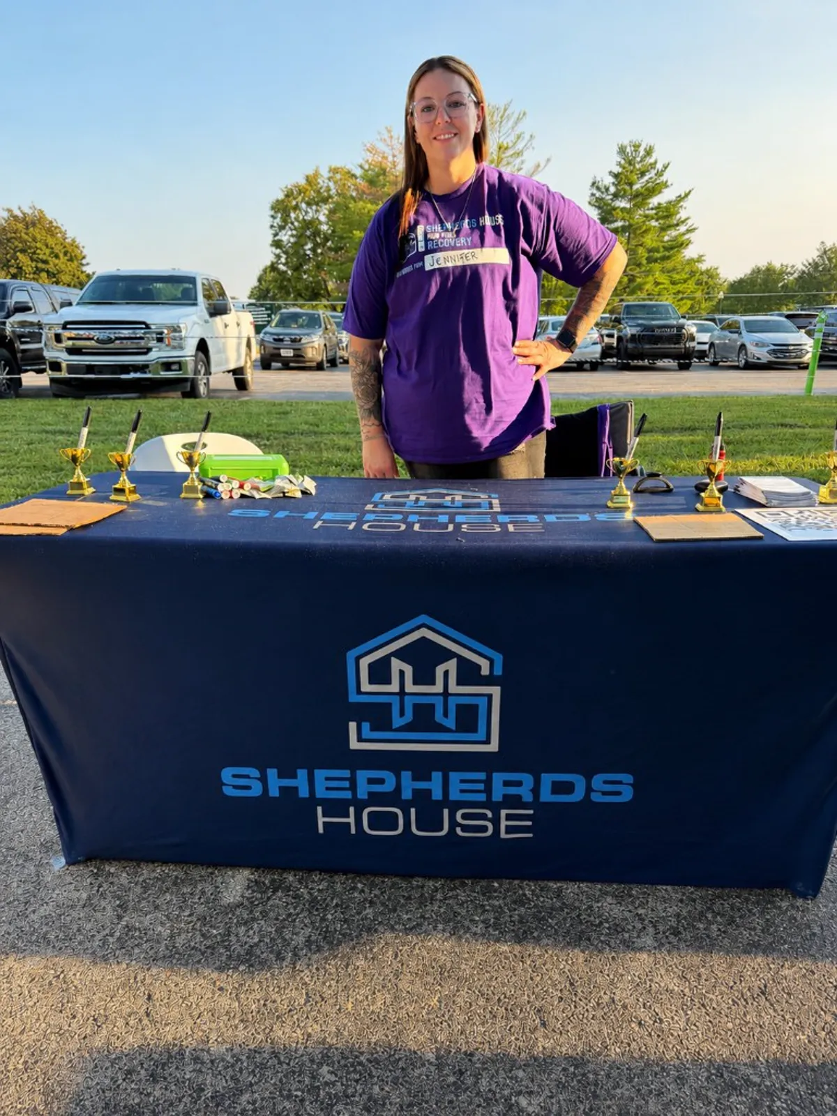 A woman holding a baby at the Run for Recovery event